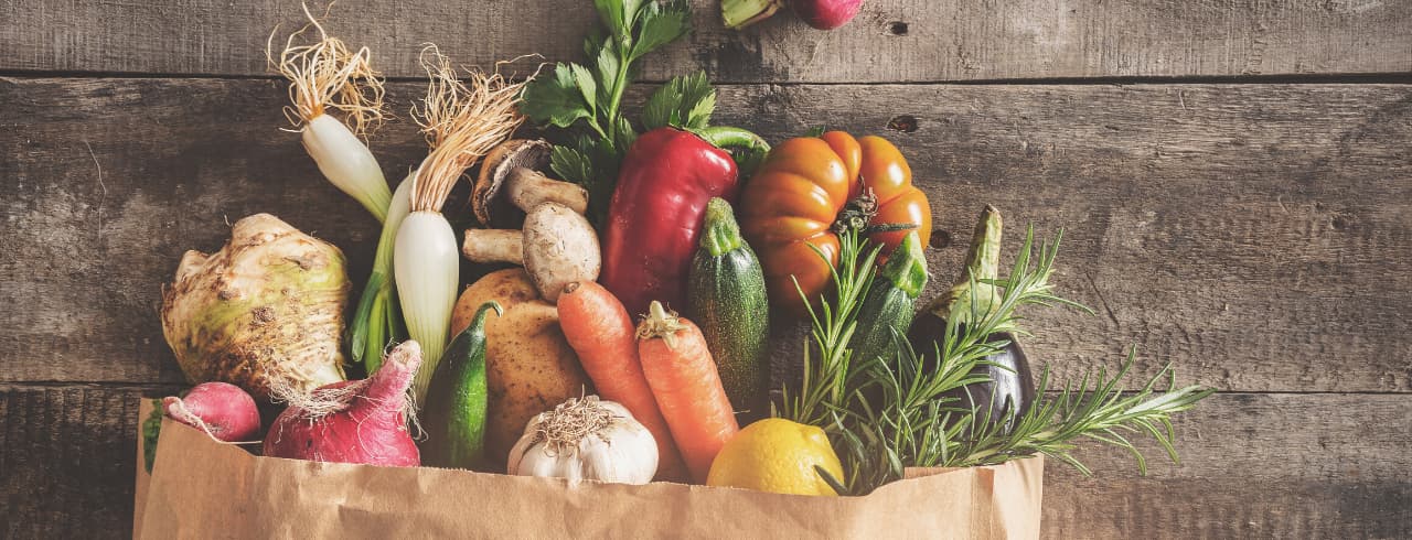 paper bag full of vegetables